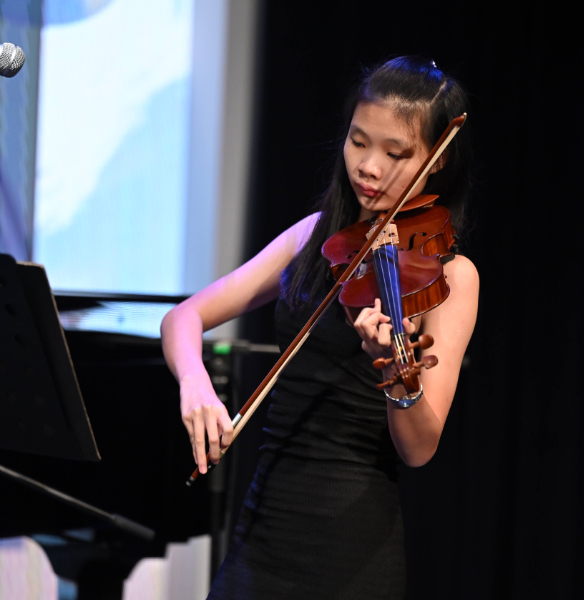 young female orchestral conductor with baton in hand, expressive face, dramatic spotlight, classical